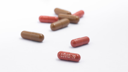 Pills with sign covid-19 on white background. Medical concept of Virus Pandemic Protection, Coronavirus COVID-19
