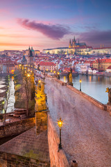 Prague, Czech Republic. Aerial cityscape image of Prague with famous Charles Bridge and Prague Castle during beautiful sunset.	