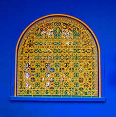 One of the many decorative windows in a garden in Marrakech