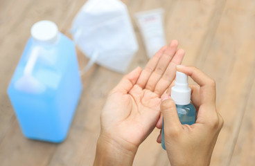 hand using alcohol spray for cleaning bacteria or virus 