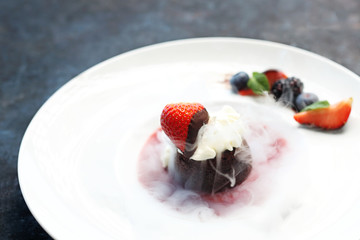 Dessert frozen with liquid nitrogen. Appetizing dessert with whipped cream.