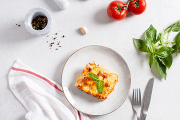 Traditional italian lasagna with vegetables, minced meat, cheese bolognese and bechamel sauce. Top view, menu, recipe. COpy space