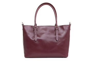 expensive red female leather bag on a handle isolated on a white background