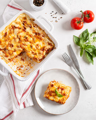 Traditional italian lasagna with vegetables, minced meat, cheese bolognese and bechamel sauce. Top view, menu, recipe