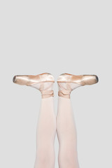 Ballerina legs in light classic pointe shoes