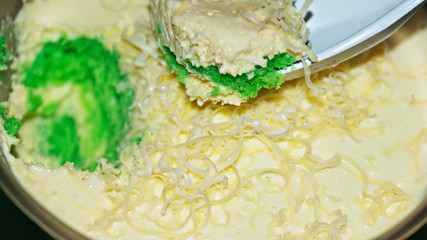 Close up Pandan leaf cheesecake on wooden background. Selective focus depth of field. (image contain certain grain or noise and soft focus when view at full resolution).