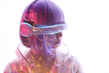 Naklejka premium Beautiful woman with purple hair in futuristic costume over white background. Girl in glasses of virtual reality. Augmented reality game, future technology, AI concept. VR. Blue and violet neon light.