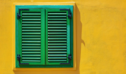 Beautiful windows or doors in a variety of colors and forms with walls textures and old details.