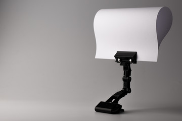 Empty  white paper with black stand