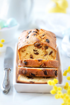 Delicious traditional fruitcake with raisins and candied fruit. Sliced plumcake with glaced fruit