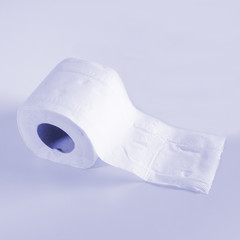 Roll of toilet papers on a soft color background.