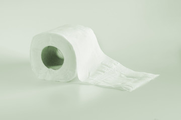 Roll of toilet papers on a soft color background.