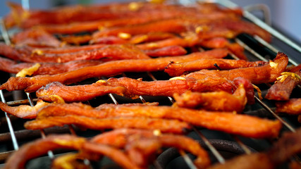 Sun-dried pork grilled on a grill.
