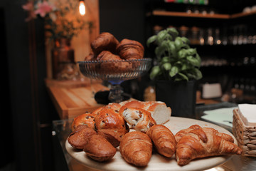 Pastry, buns on croissant background