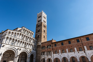 Obraz premium Lucca, facade and bell tower of the Cathedral of San Martino (Saint Martin), in Romanesque Gothic style, XI century. Tuscany, Italy, Europe
