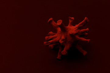 Red Virus Strain Model Of Coronavirus Covid-19 On Black Background. Microbiology And Virology Concept. Red filter