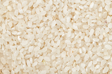 Rice texture close up. Natural rice background and texture. White long grain rice. Jasmin rice