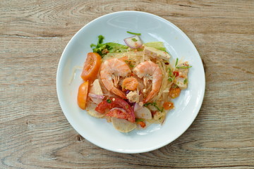 glass noodle with shrimp and minced pork spicy salad on plate 