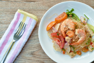 glass noodle with shrimp and minced pork spicy salad on plate 