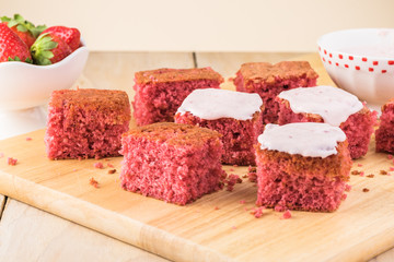 Homemade strawberry sheetcake with strawberry frosting.