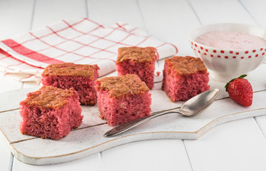 Homemade strawberry sheetcake with strawberry frosting.