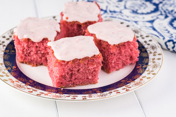 Homemade strawberry sheetcake with strawberry frosting.