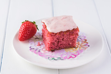 Homemade strawberry sheetcake with strawberry frosting.