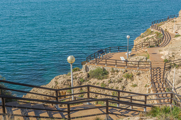 View of mediterranean sea from "Cantal's Cliff" in "Cala of Moral". Malaga. Spain.View of walking trail in "Cantal's Cliff" next to Mediterranean sea in "Cala of Moral". Malaga. Spain.
