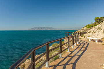 View of walking trail in "Cantal's Cliff" next to Mediterranean sea in "Cala of Moral". Malaga. Spain.