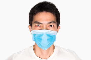 Asian man wearing face mask for protect corona virus and air pollution, pm 2.5, on white background. Medical and healthcare concept