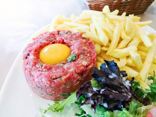 tasty Steak tartare (Raw beef) - classic steak tartare on white plate