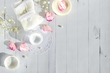 Beautiful spa composition with spring flowers on a light wooden background