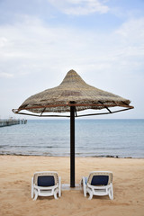 Sun set on the beach in Egypt north coast / dahab / hurgada / sharm el sheikh / taba / alexandria  - best place for vacation under umbrella  - holiday relaxation beach sand inspiration happiness  tan.