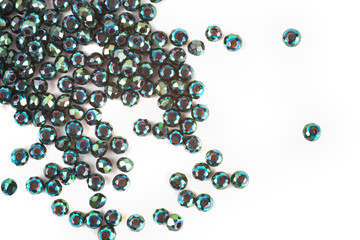 close up multi colored beads heap isolated on white