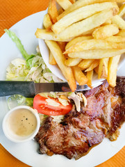 juicy steak beef meat with tomato and french fries