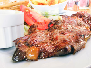 juicy steak beef meat with tomato and french fries