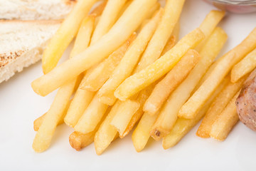 Fragmnet of the breakfast with french fries.