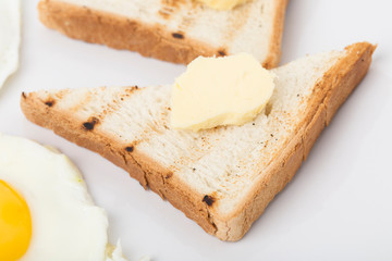 Fragmnet of the breakfast with the toast.