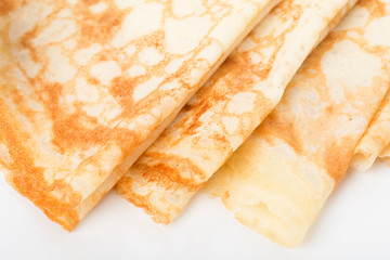 Part of breakfast with row of pancakes.