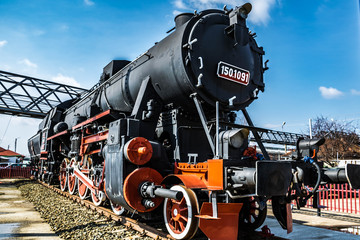Fototapeta premium Steam locomotive and blue sky in the background