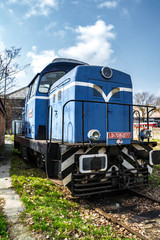 Fototapeta na wymiar Blue diesel locomotive moving on railway.