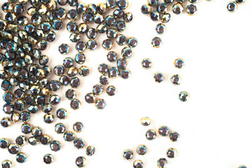 close up multi colored beads heap isolated on white