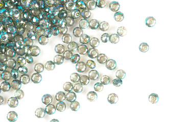 close up multi colored beads heap isolated on white