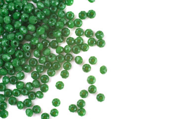 close up multi colored beads heap isolated on white