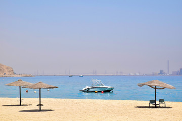Fototapeta na wymiar Sun set on the beach in Egypt north coast / dahab / hurgada / sharm el sheikh / taba / alexandria - best place for vacation under umbrella - holiday relaxation beach sand inspiration happiness tan.