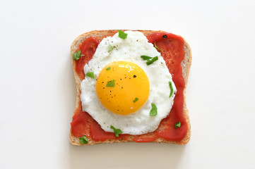 Fried Egg On Slice Of Toast Isolated