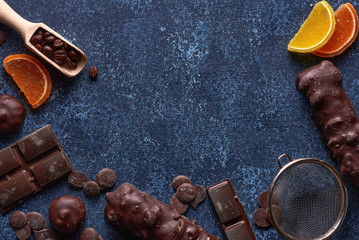 Chocolate and marmalade candys on blue background