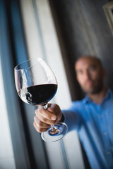 Businessman Holding Red Wine Glass