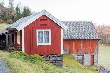 Fototapeta premium EIKSUND, NORWAY - 2016 NOVEMBER 02. Old red charming farmer house.