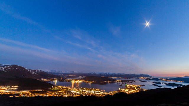 ULSTEINVIK, NORWAY - 2016 APRIL 12. Ulsteinvik by night with full moon